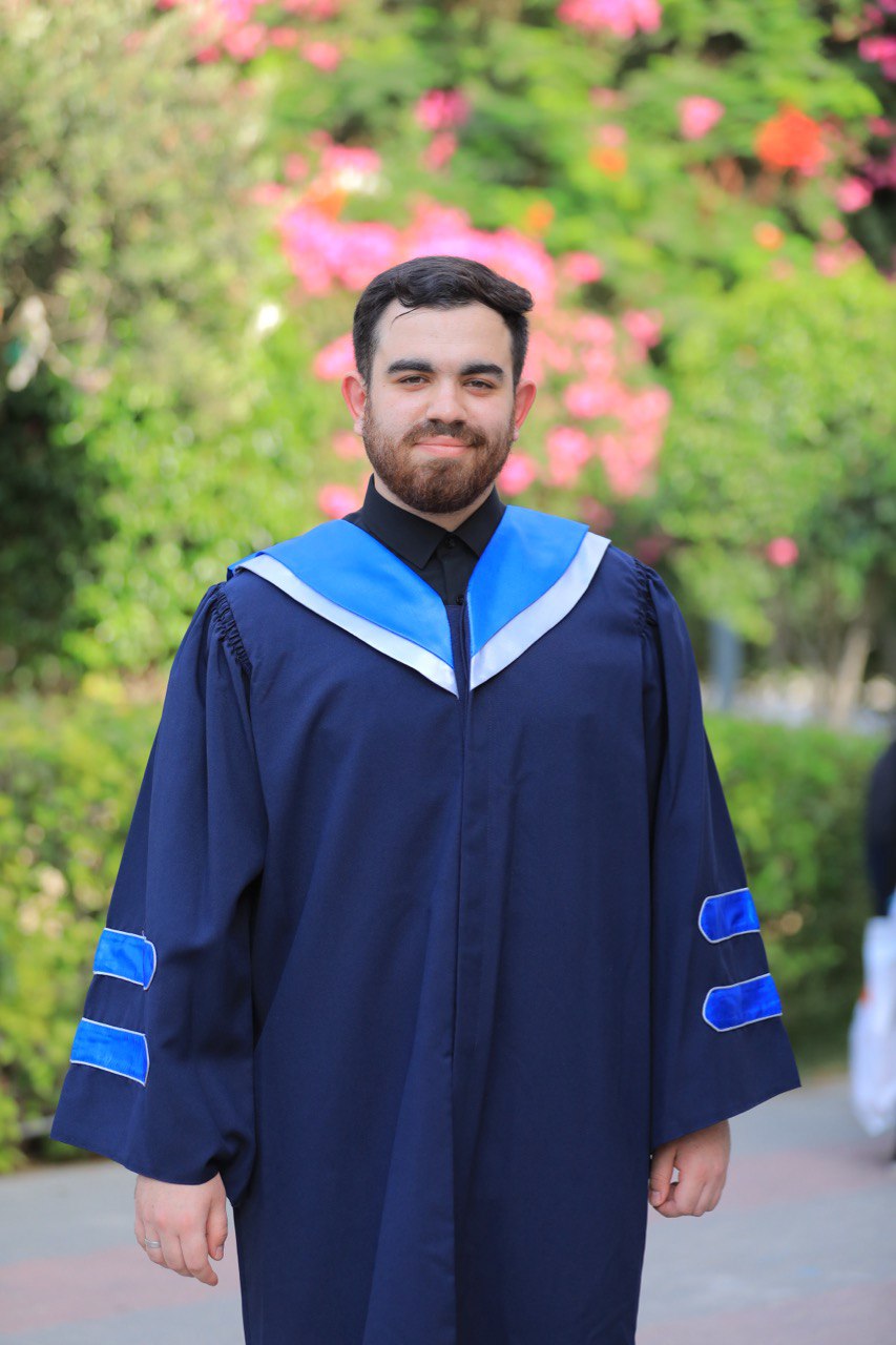 Mahmoud Abusaqer in graduation attire